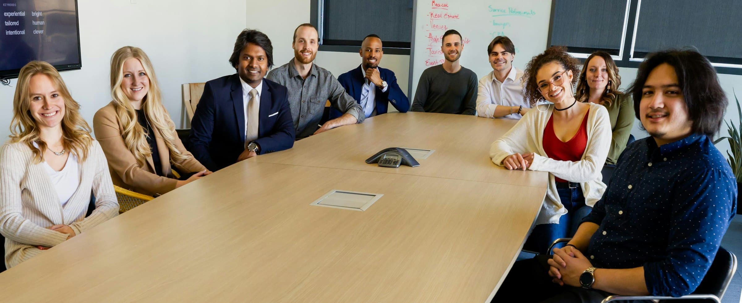 A diverse team meeting around a conference table